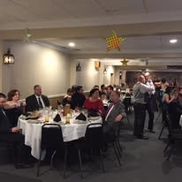Attendees at a Hearts with Hope banquet dinner event