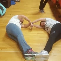 Candid photo of participants on a gymnasium floor at a Hearts with Hope event