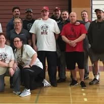Large group of Hearts with Hope volunteers and members at a community event